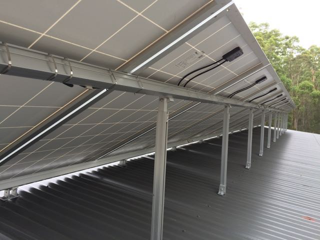 Rear of a 7kW solar array on stands.
